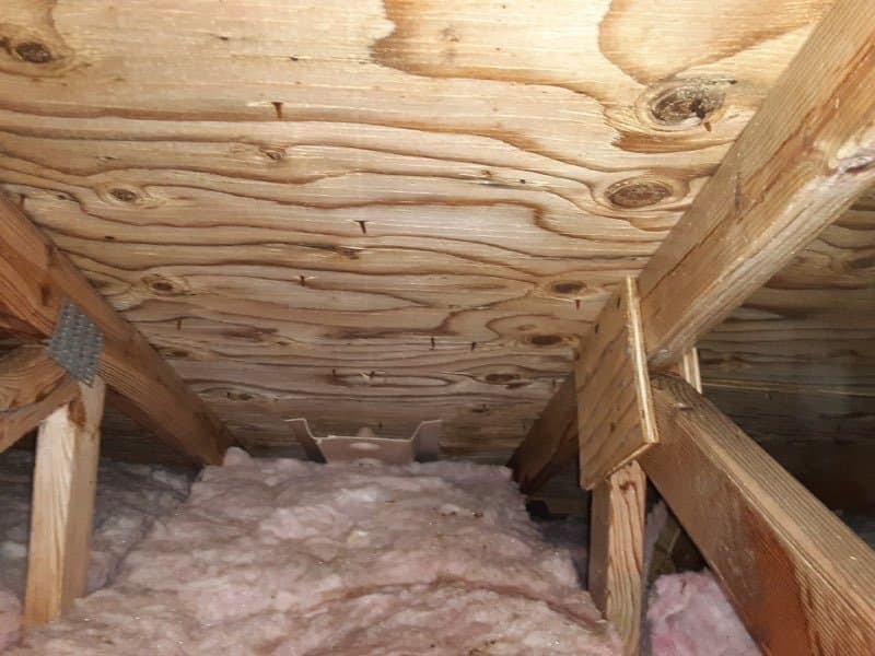 Attic decking and rafters clear of mold staining after mold remediation
